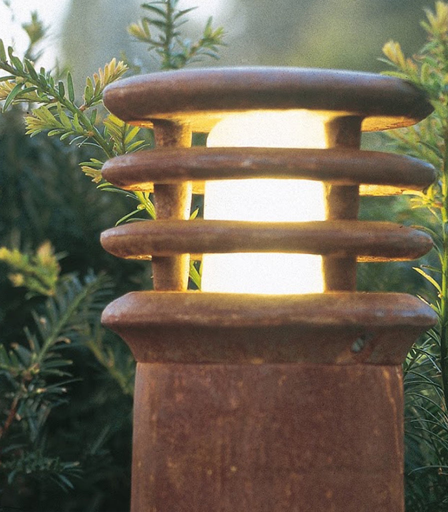 Royal Botania Rusty Bollard Light featured within outdoor space