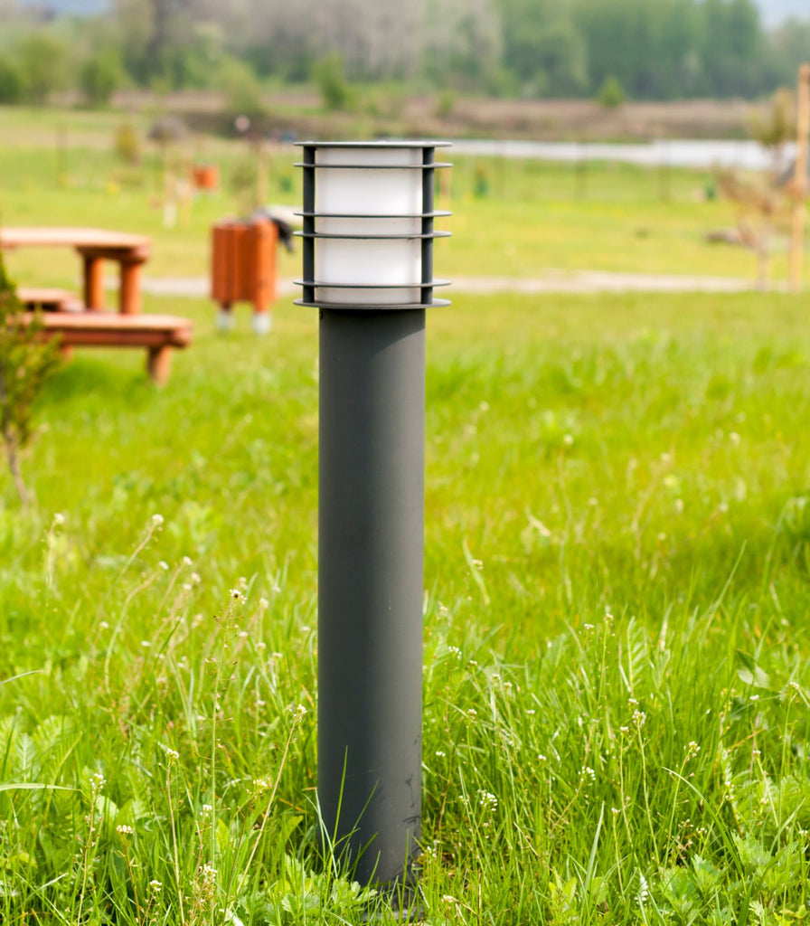 Norlys Stockholm Bollard Light featured within a outdoor space