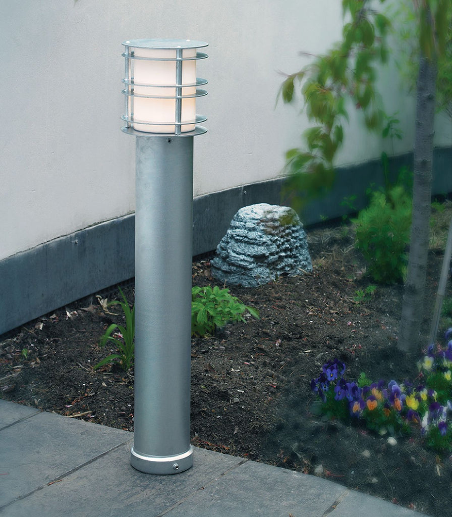 Norlys Stockholm Bollard Light featured within a outdoor space
