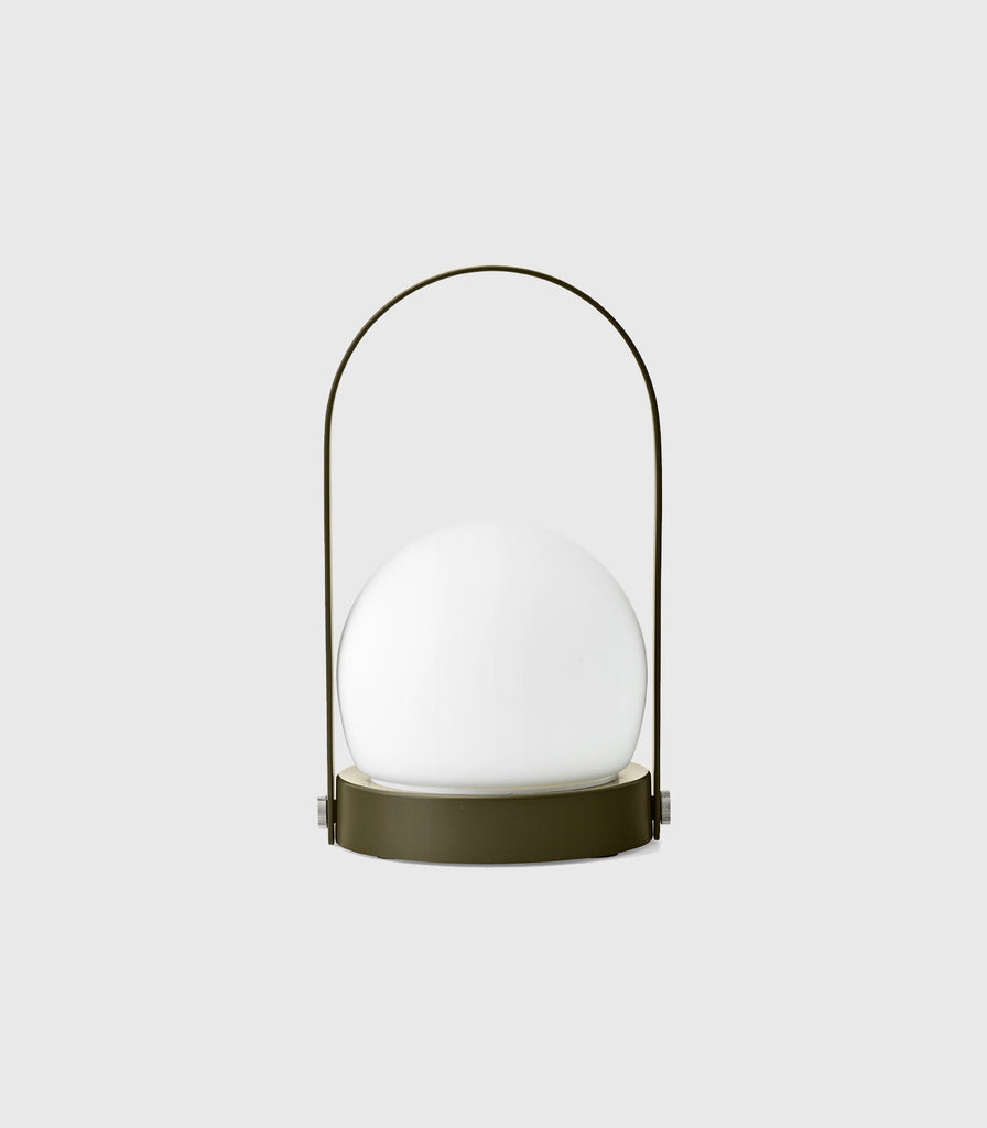 Menu Lighting Carrie Portable Table Lamp featured within interior space