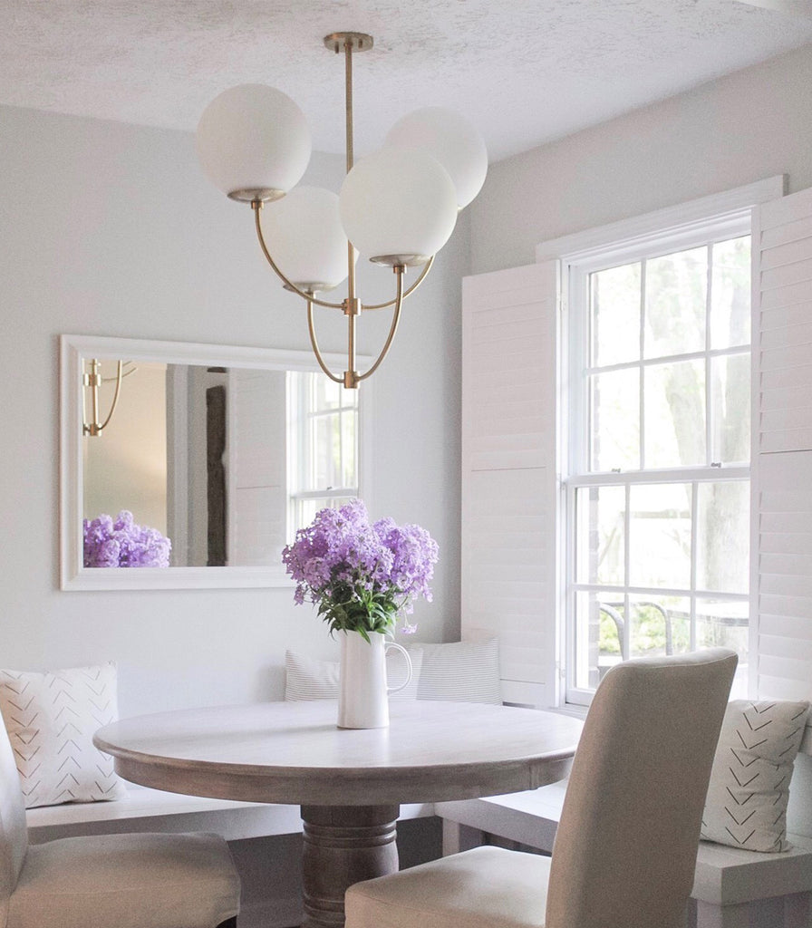 Hudson Valley Carrie Chandelier hanging over dining table