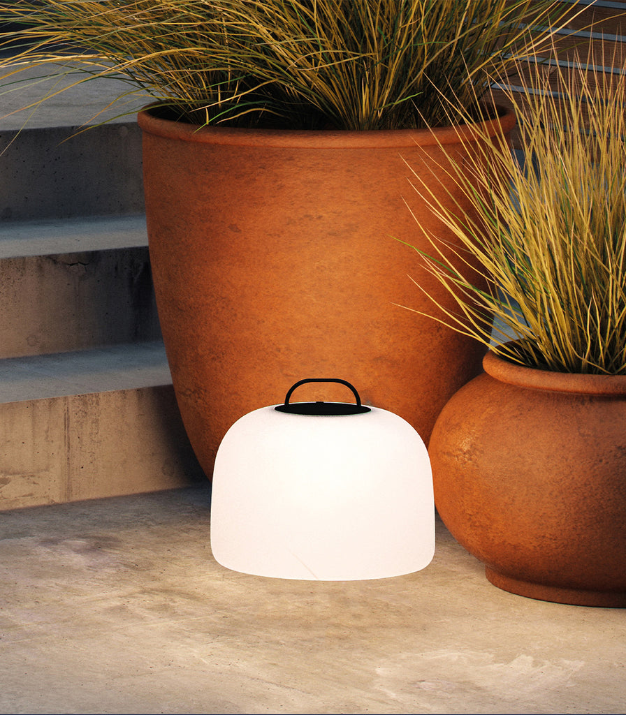 Nordlux  Kettle Tripod Floor Lamp featured within outdoor space