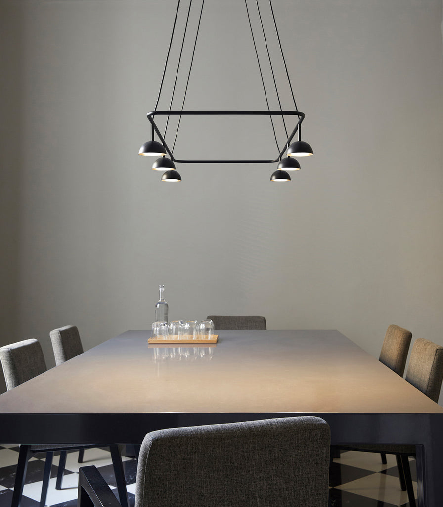 Estiluz Cupolina Linear Pendant Light hanging over dining table