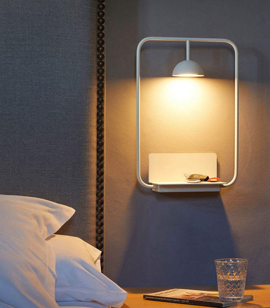 Estiluz Cupolina Wall Light in White featured above bedside table