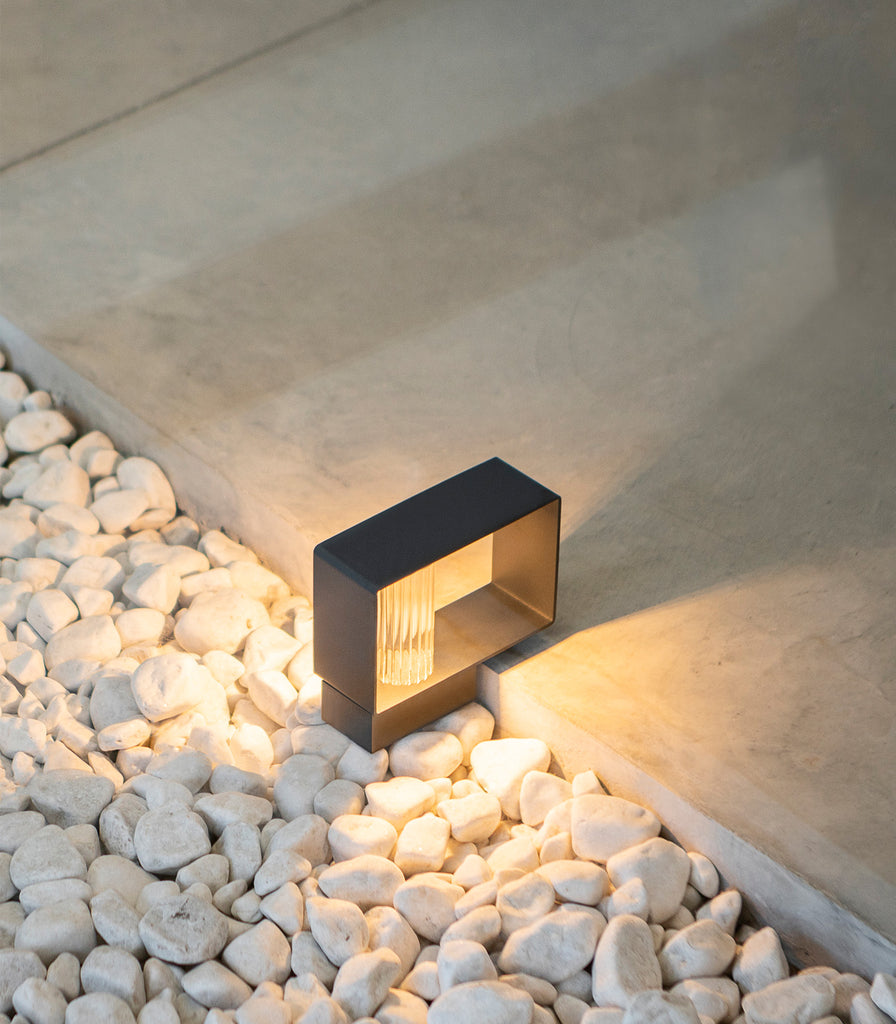 Estiluz Frame Mini Bollard Light featured within outdoor space