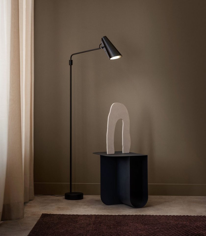 Northern Birdy Swing Floor Lamp featured within a interior space