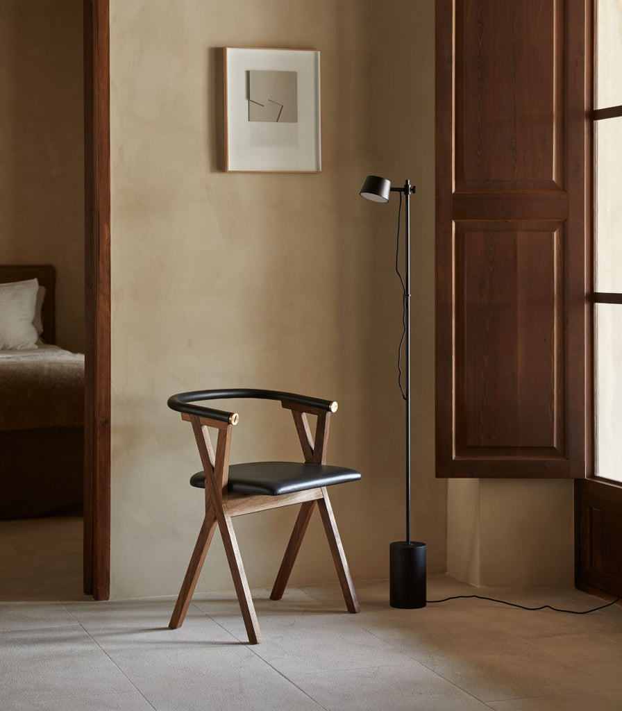 Aromas Nera Floor Lamp placed beside chair