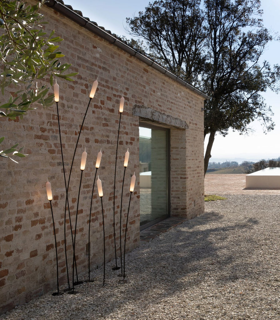 Karman Nilo Outdoor Floor Lamp featured within a outdoor space