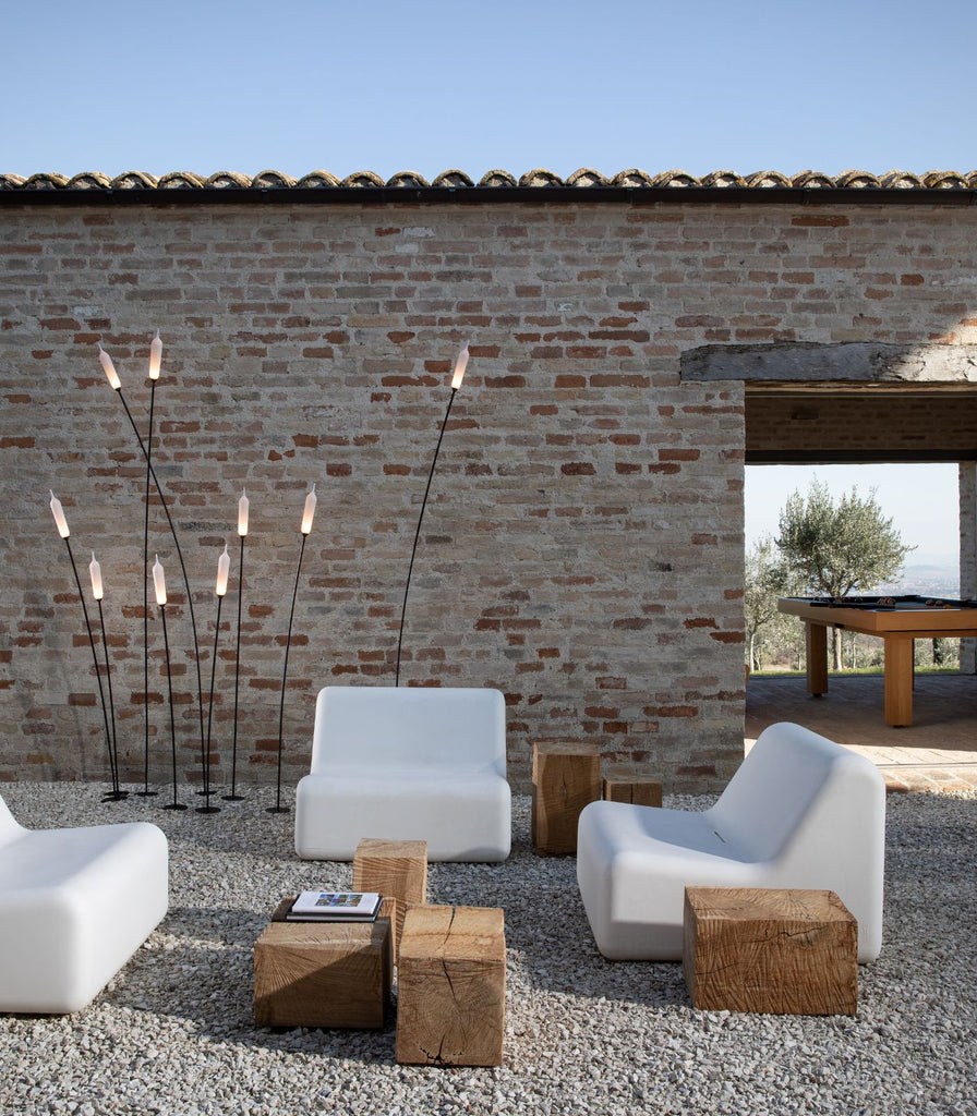 Karman Nilo Outdoor Floor Lamp featured within a outdoor space