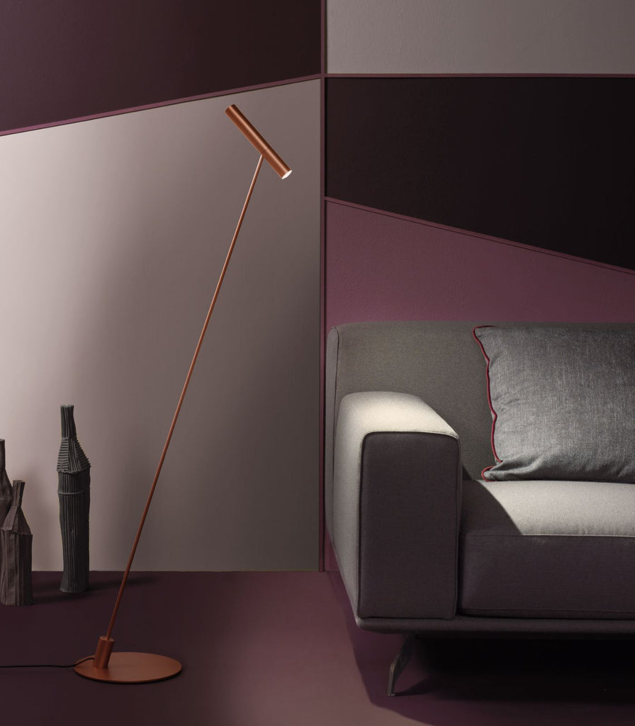 Oty Pinocchio Floor Lamp in Copper featured within a interior space