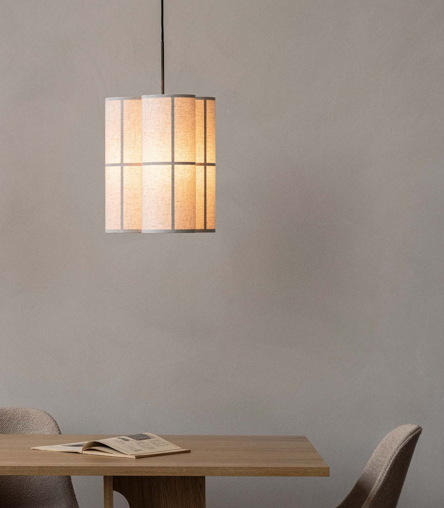 Menu Lighting Hashira Small Cluster Pendant Light hanging over dining table