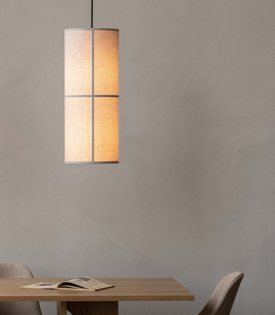 Menu Lighting Hashira Pendant Light hanging over dining table