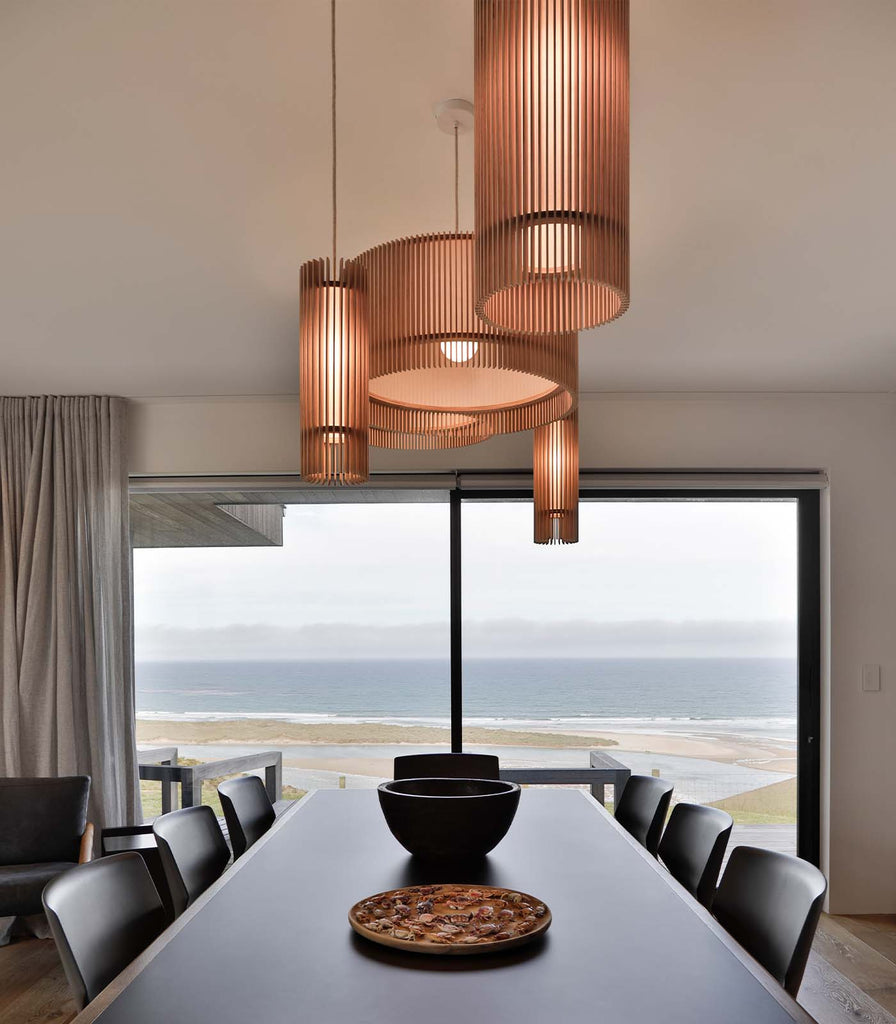 Maker Design Studio iO long pendant light cluster in dining space