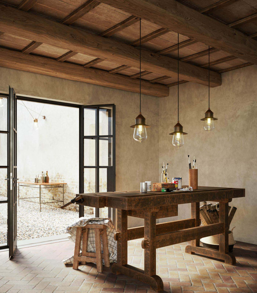 Il Fanale Drop Pendant Light hanging over dining table