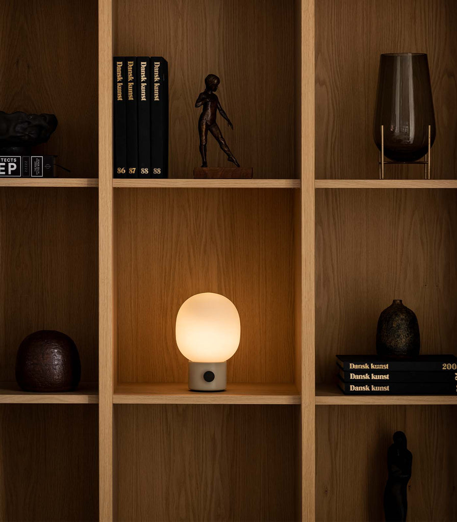 Menu Lighting JWDA Portable Table Lamp featured within interior space