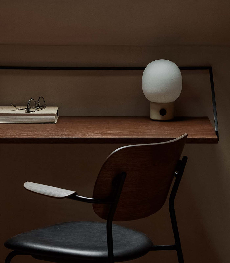 Menu Lighting JWDA Portable Table Lamp featured within interior space