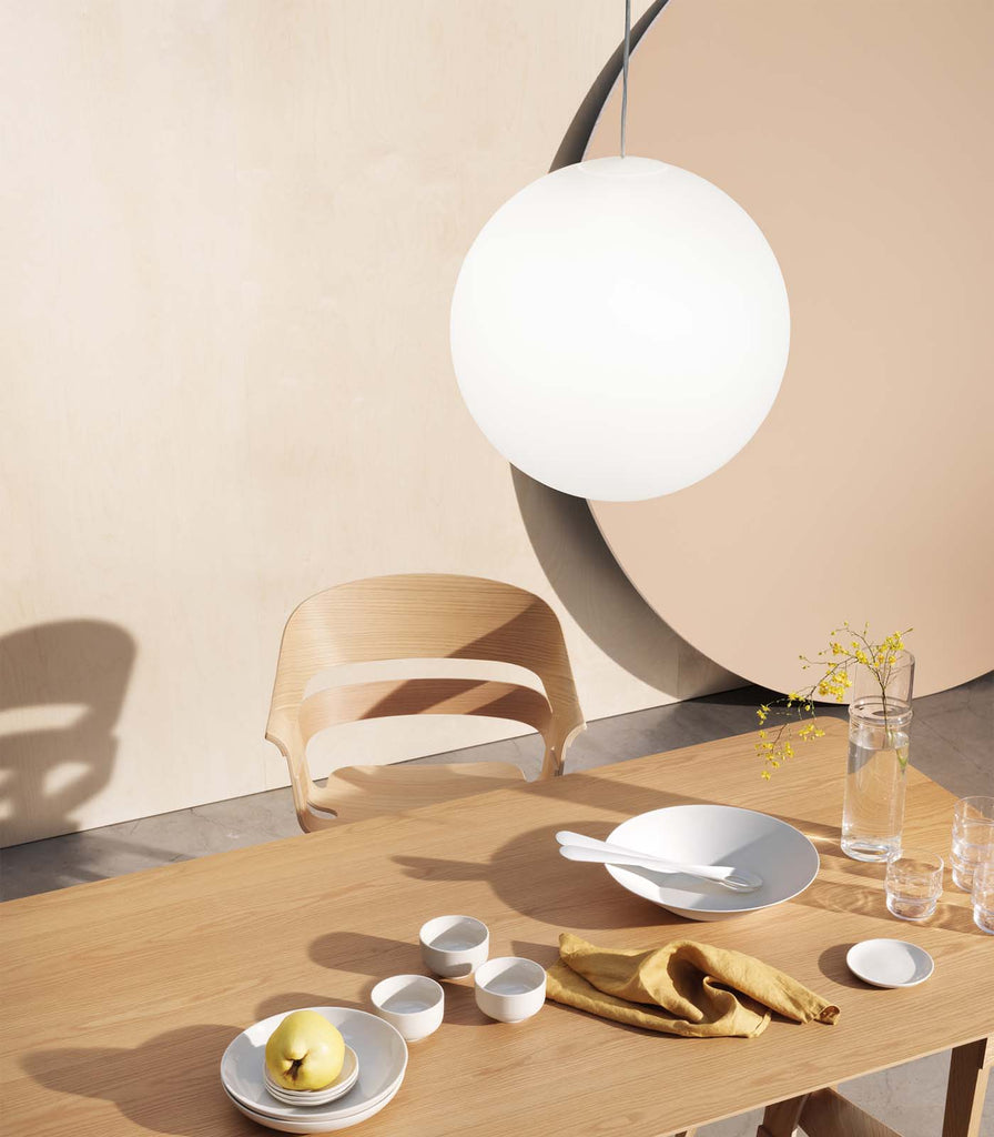 Nordic Fusion Luna Opaque Pendant Light hanging over dining table