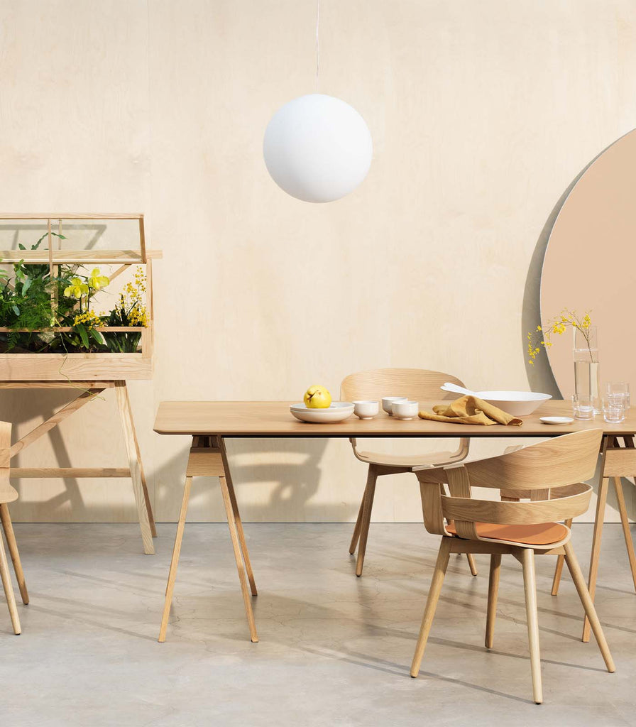 Nordic Fusion Luna Opaque Pendant Light hanging over dining table