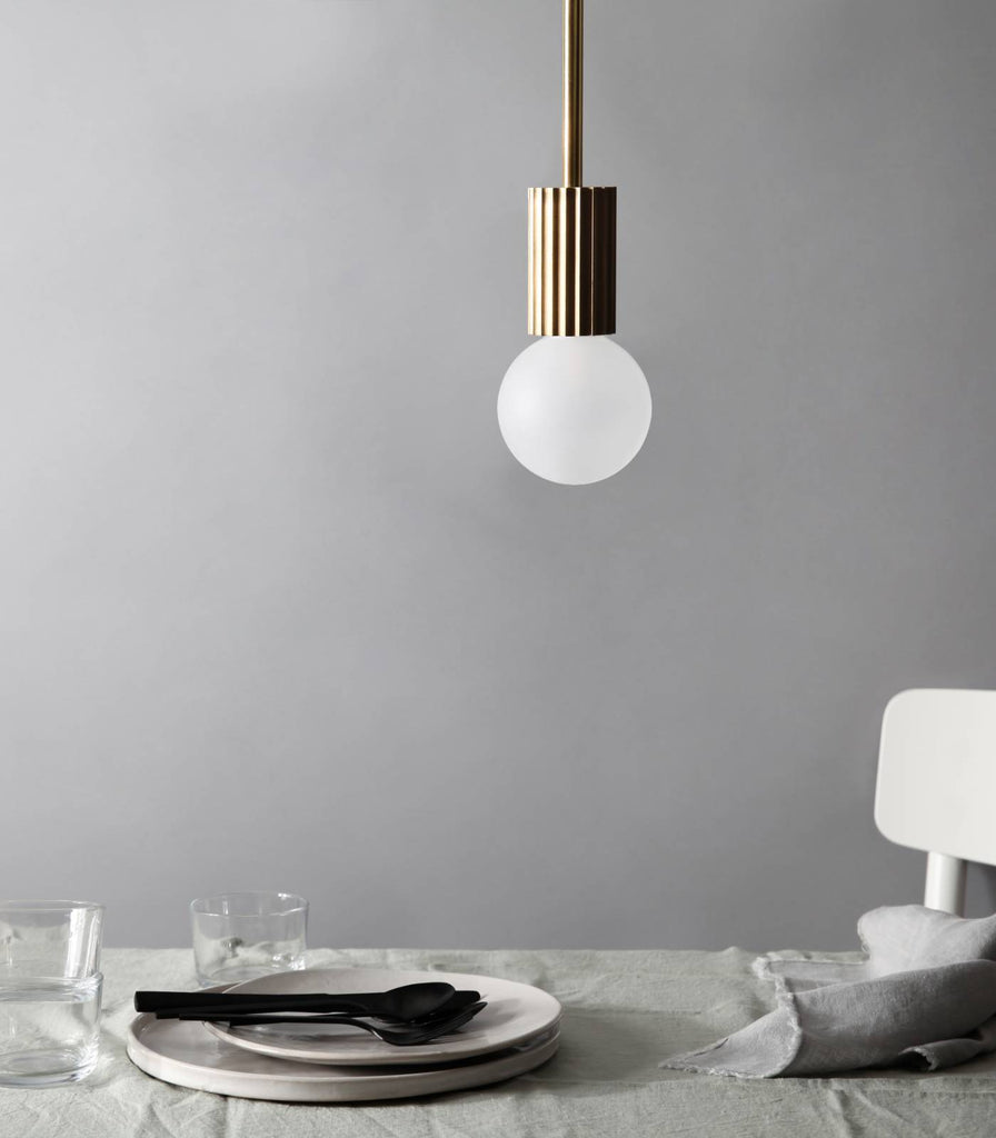 Marz Designs Attalos Pendant Light hanging over dining table