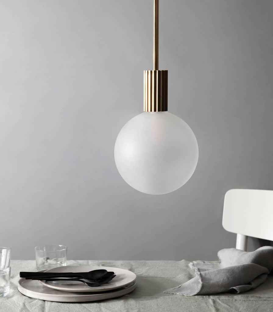 Marz Designs Attalos Pendant Light hanging over dining table