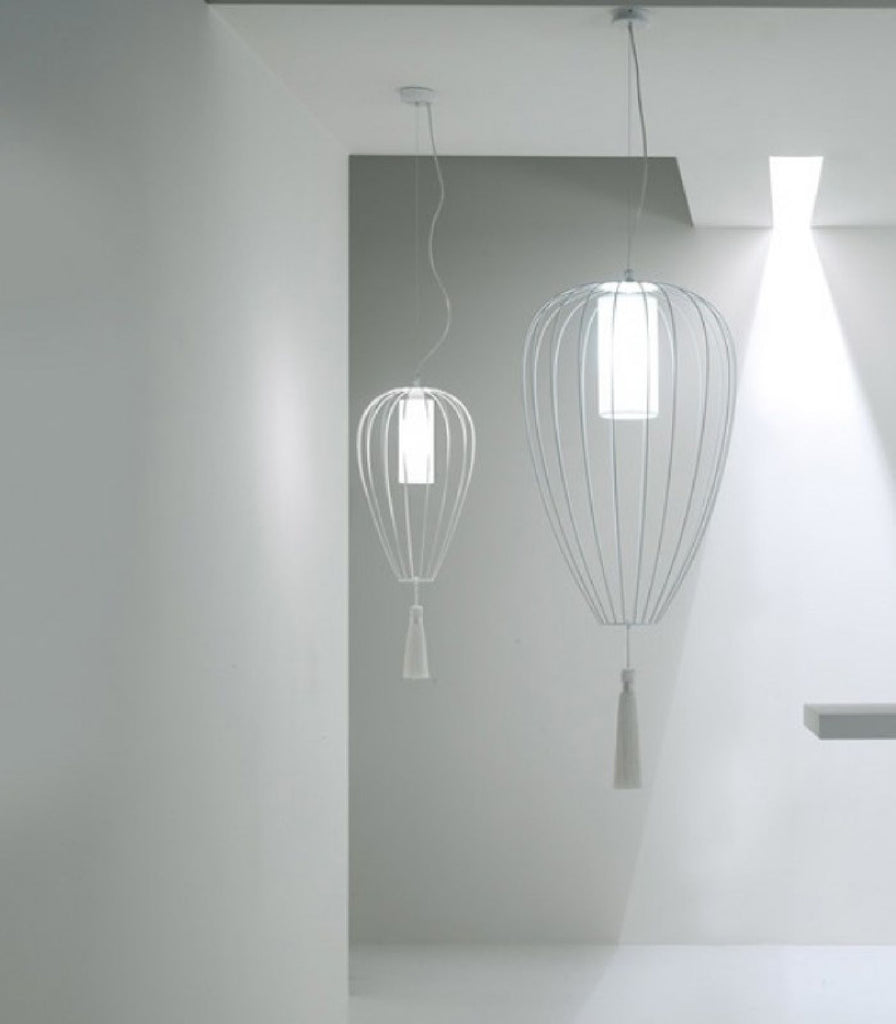 Karman Cell Narrow Pendant Light featured within a interior space