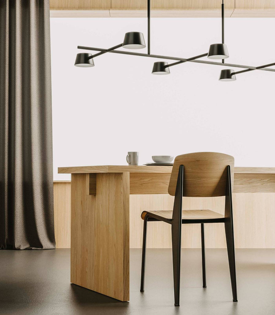 Aromas Nera 6lt Pendant Light hanging over dining table