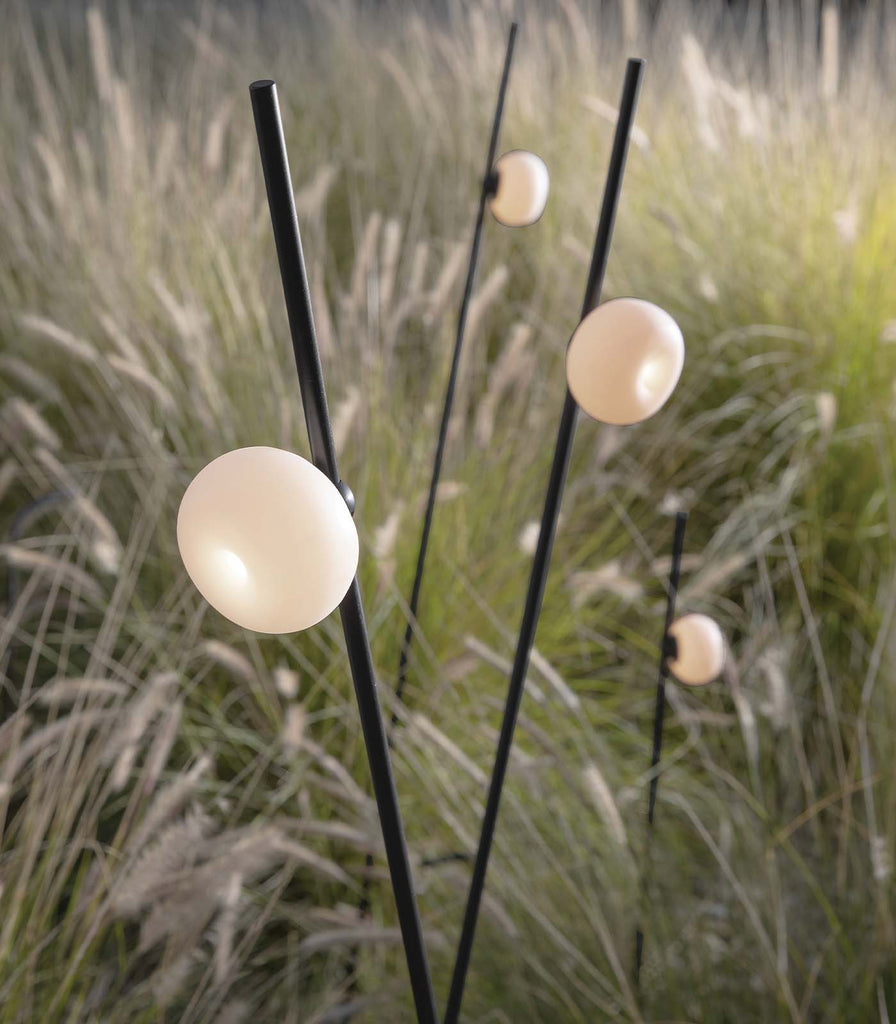 Karman Pois Floor Lamp featured within a outdoor space