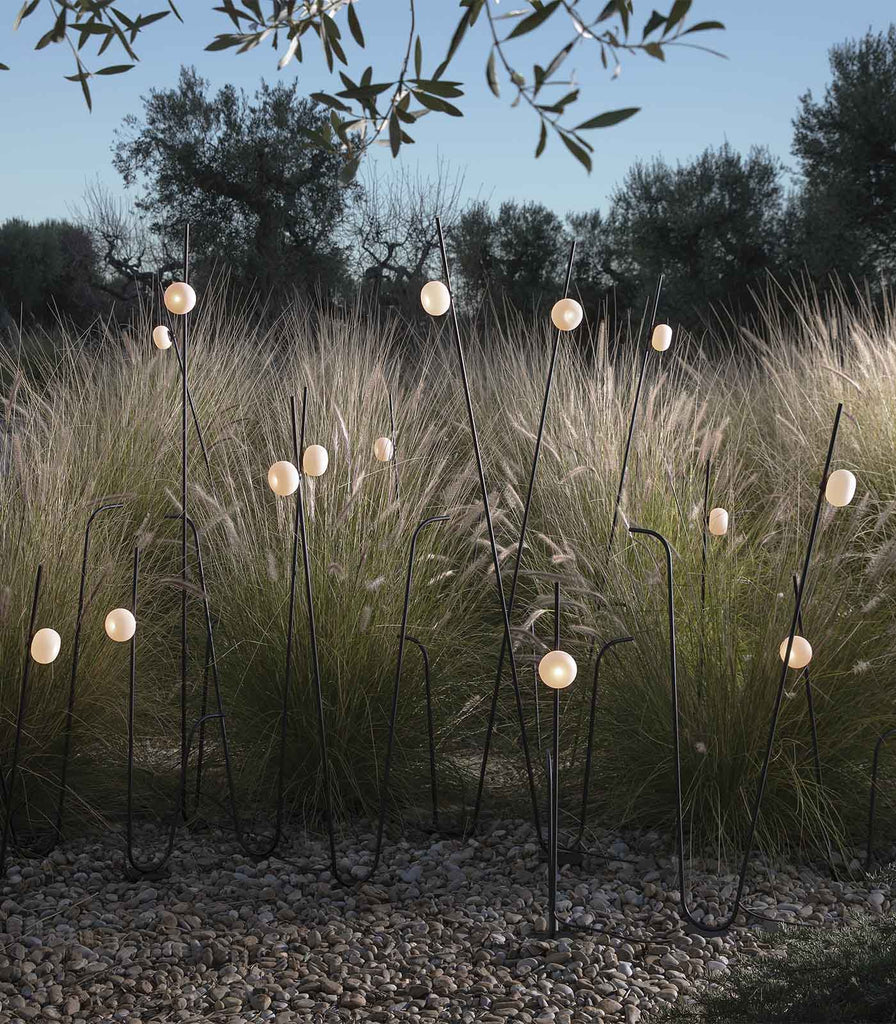 Karman Pois Floor Lamp featured within a outdoor space