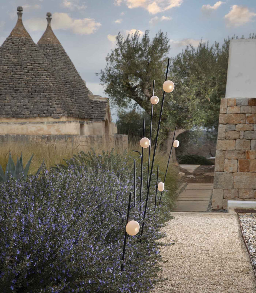 Karman Pois Floor Lamp featured within a outdoor space