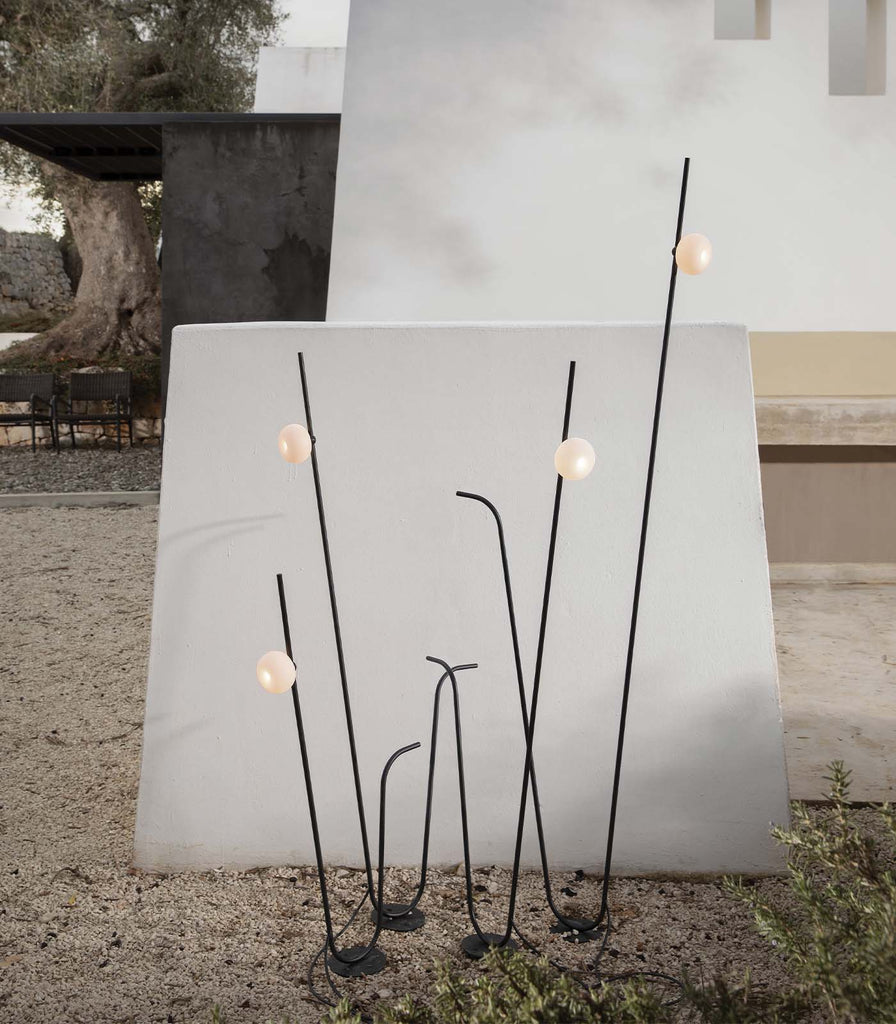 Karman Pois Floor Lamp featured within a outdoor space