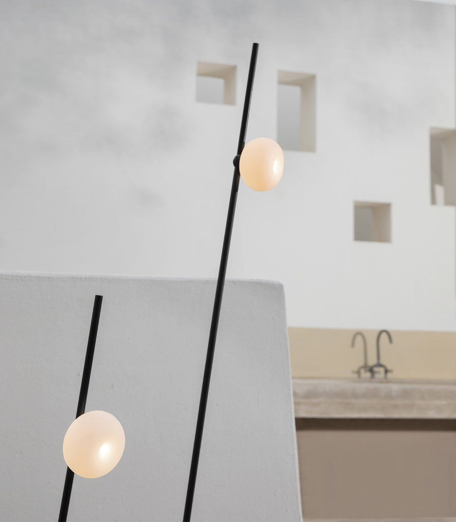 Karman Pois Floor Lamp featured within a outdoor space