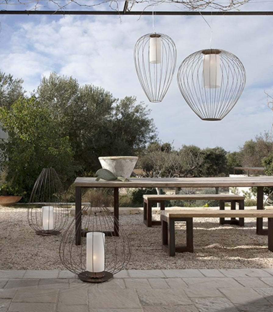 Karman Cell Wide Outdoor Pendant featured within a interior space
