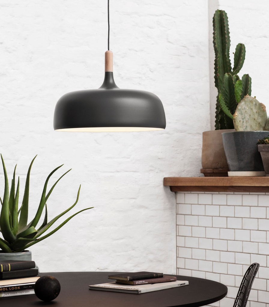 Northern Acorn Pendant Light hanging over a dining table