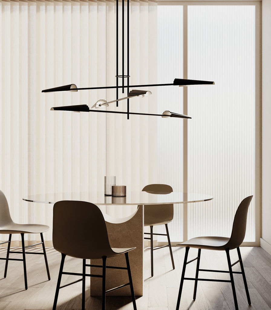 Aromas Bion Pendant Light hanging over dining table