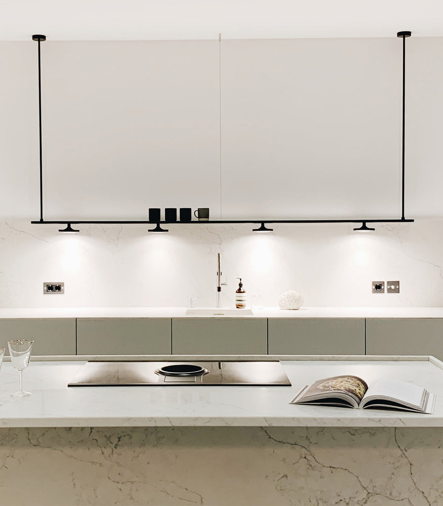 Estiluz Button 4lt Linear Pendant Light hanging over kitchen bench