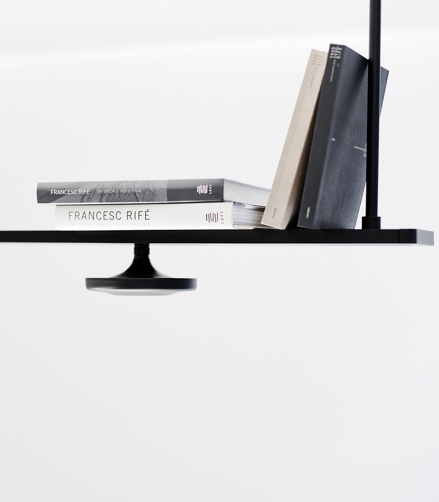 Estiluz Button 4lt Linear Pendant Light fetaured within interior space