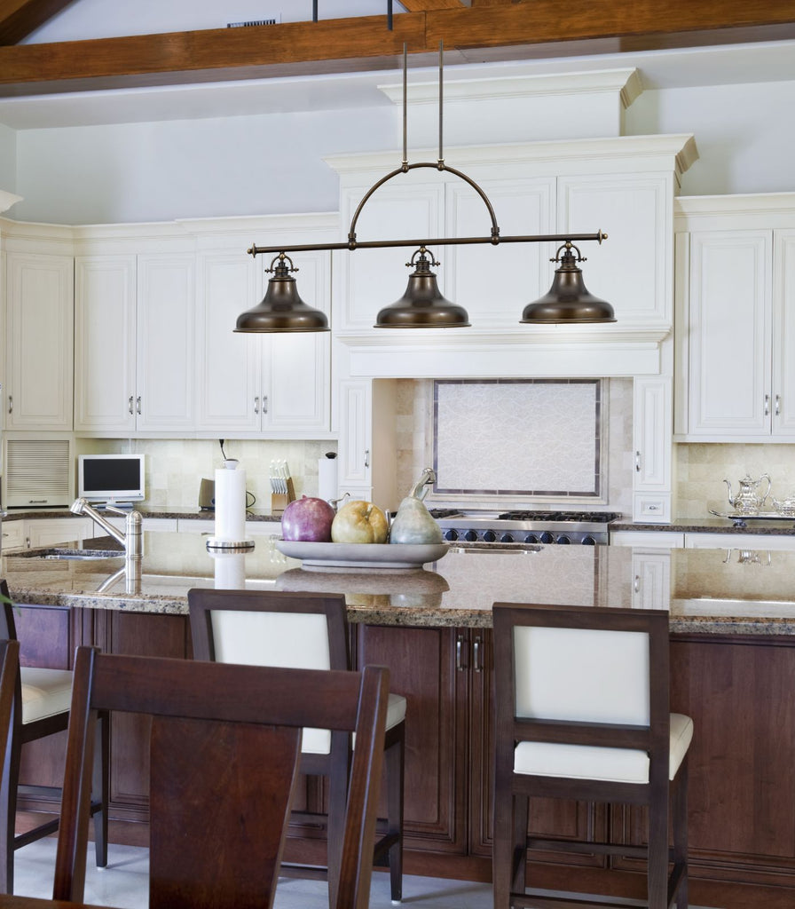 Elstead Emery Chandelier hanging over kitchen bench