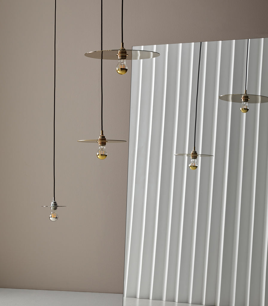 Aromas Disc Pendant Light featured within a interior space