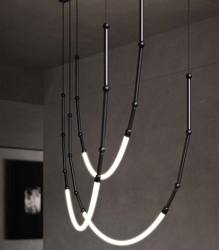 Karman Leda 3lt Curve Pendant Light featured within a interior space