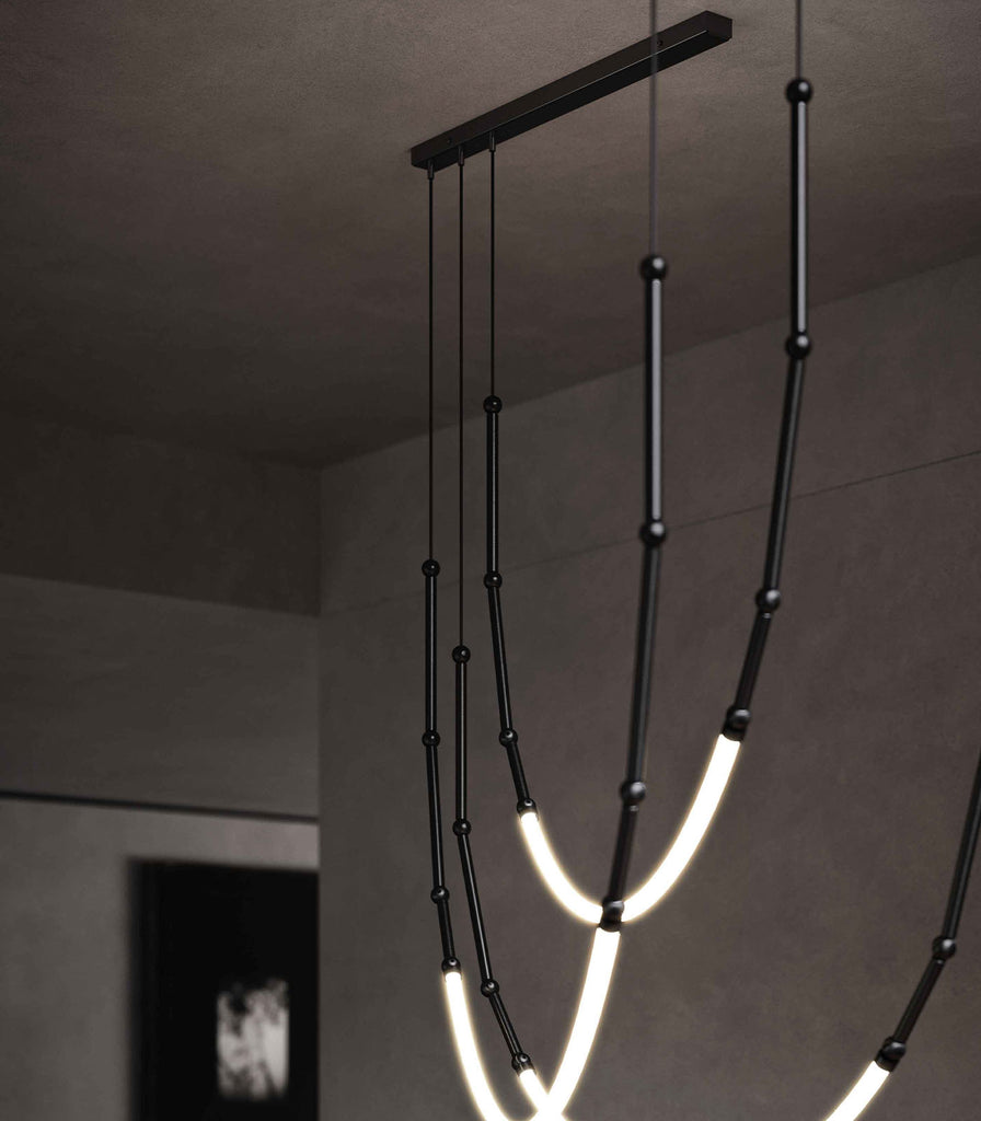 Karman Leda 3lt Curve Pendant Light featured within a interior space