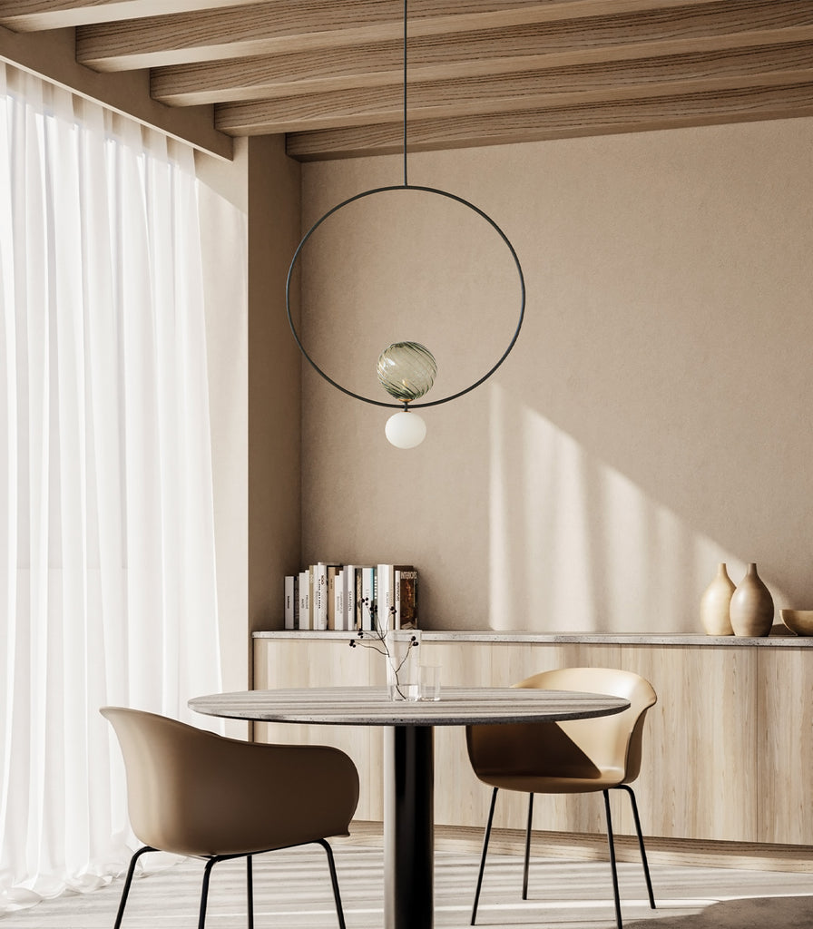 Aromas Level Pendant Light hanging over dining table