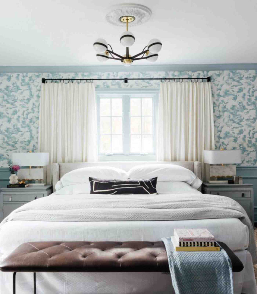 Hudson Valley Ace Pendant Light hanging over bed