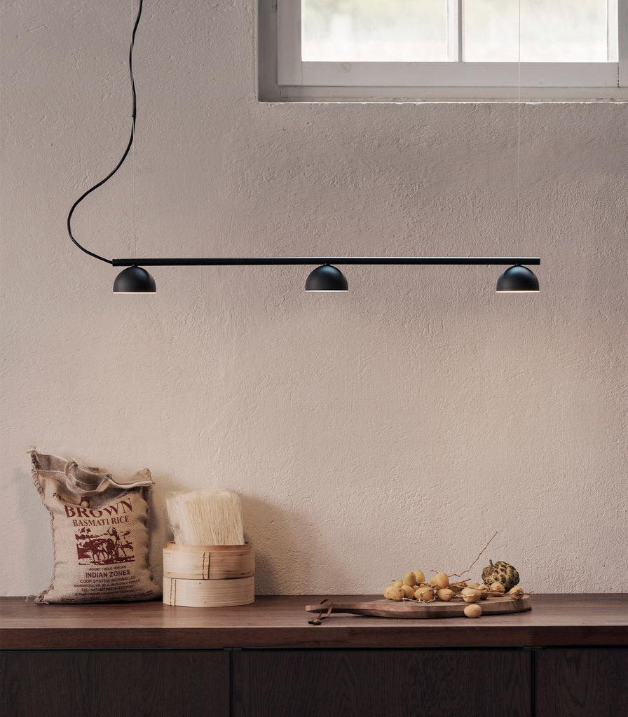Northern Blush 3lt Rail Pendant Light featured within a interior space