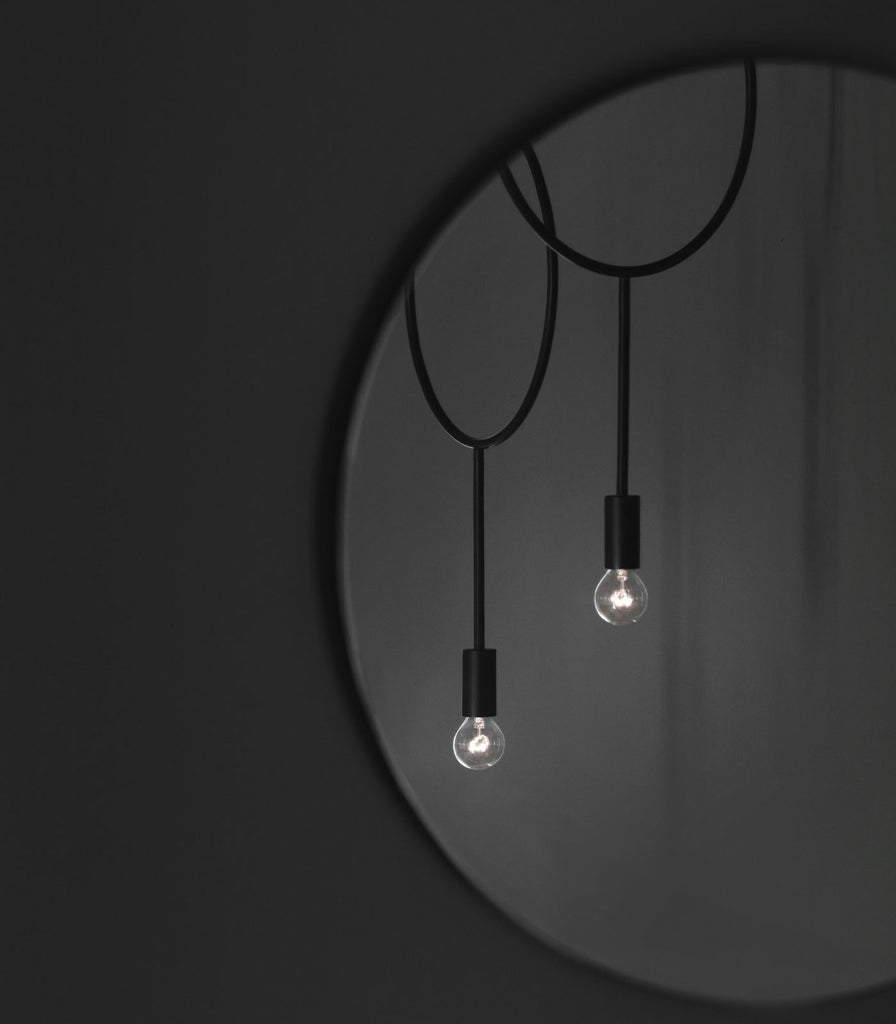 Norther Circle Pendant Light featured within a interior space