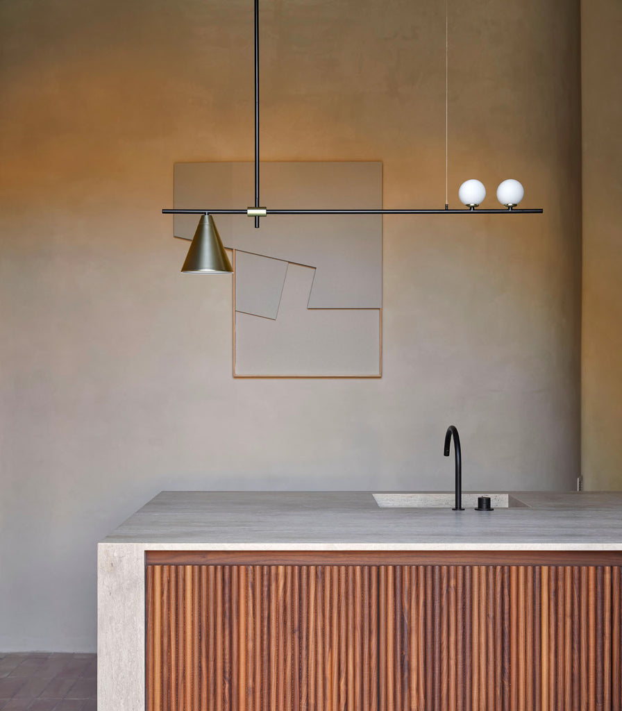 Aromas Crane Pendant Light hanging over a kitchen bench