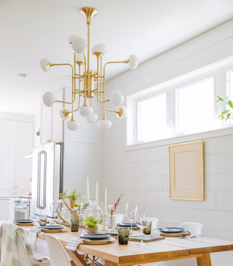 Hudson Valley Fleming Pendant Light hanging over a dining table