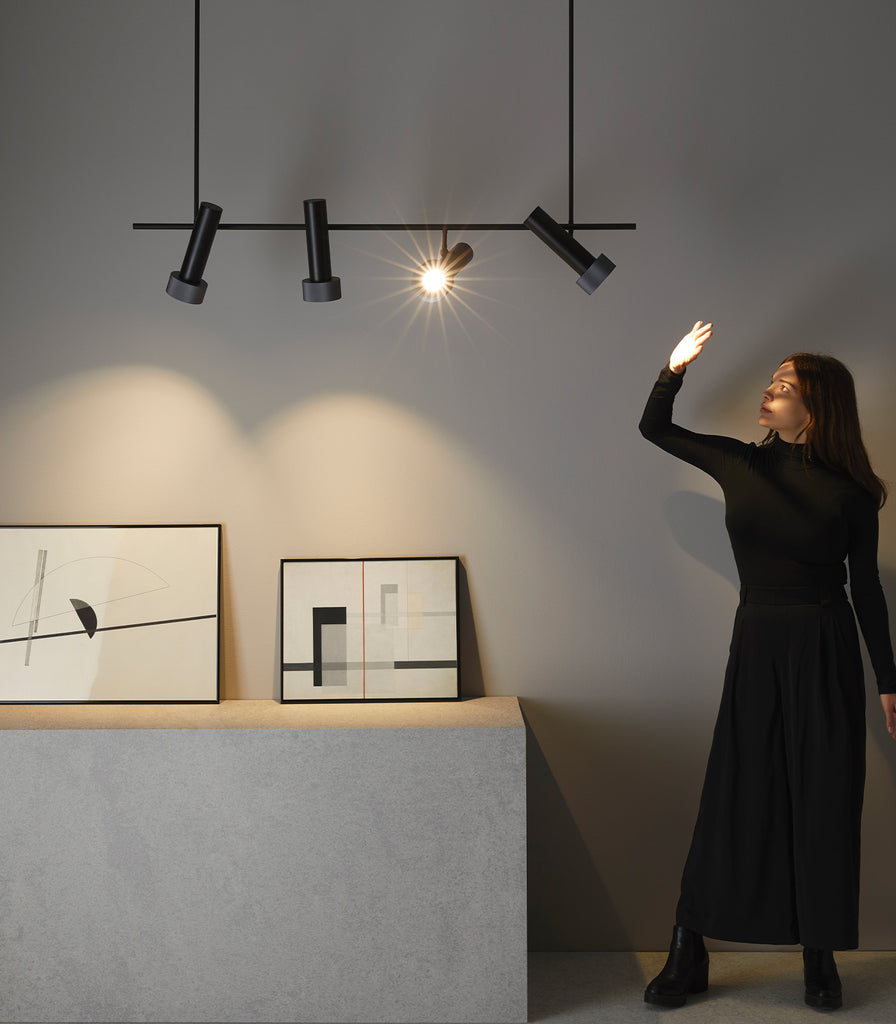 Aromas Focus Linear Pendant Light eatured within a interior space