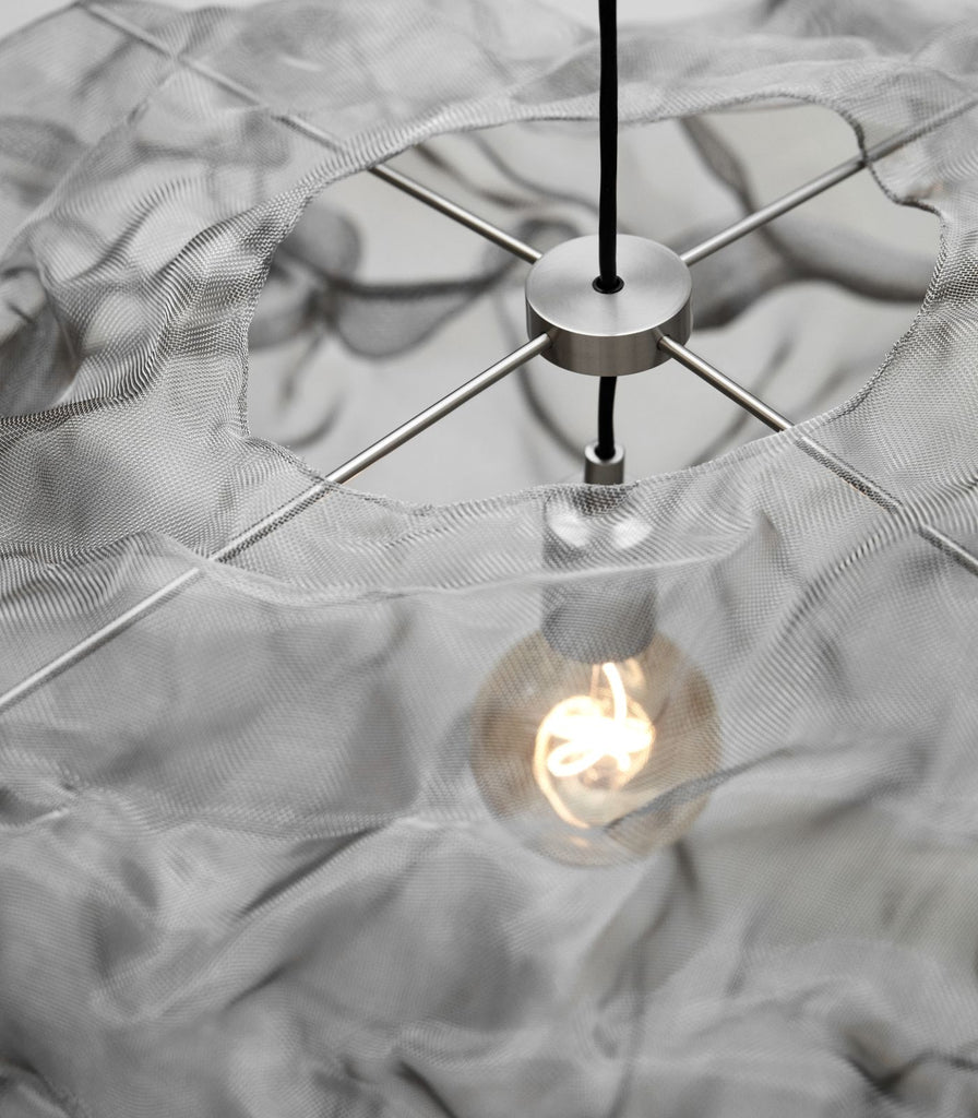 Northern Heat Small Pendant Light featured within a interior space