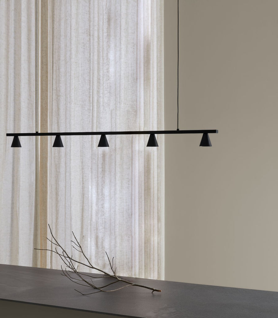 Aromas Lyb Pendant Light hanging over table