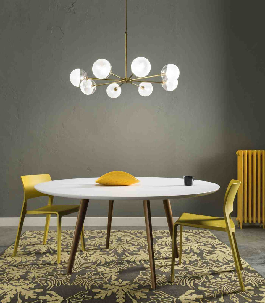 Il Fanale Molecola 8lt Pendant Light hanging over dining table